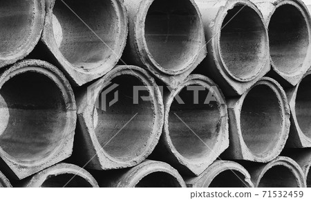 Concrete pipes. The texture is round gray. Materials for construction. Texture. Geometry. Concrete pipes. The texture is round gray. Materials for construction. Texture. Geometry. 71532459
