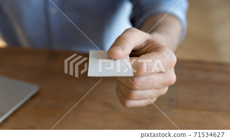 Businessman give business card to client closeup image 71534627