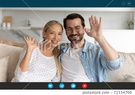 Happy young european family couple holding video call. 71534700