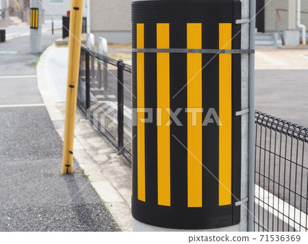 Utility pole sign board in a residential area 71536369