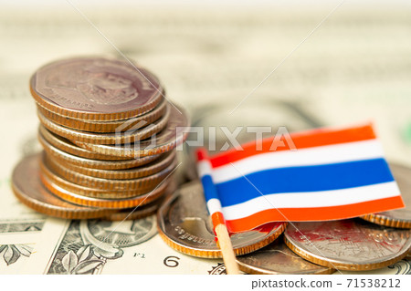 Stack of coins with Thailand flag on USA America dollar banknotes. 71538212