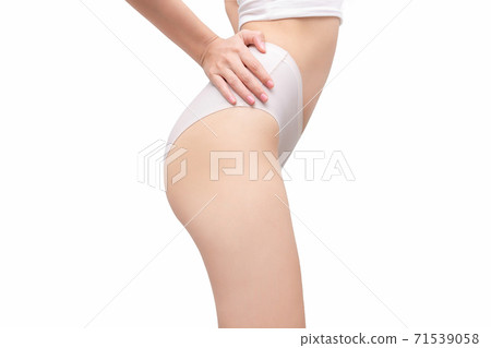 Perfect slim toned young body of the girl. Fitness or plastic surgery and aesthetic cosmetology isolated on white background. Perfect slim toned young body of the girl. Fitness or plastic surgery and aesthetic cosmetology isolated on white background. 71539058
