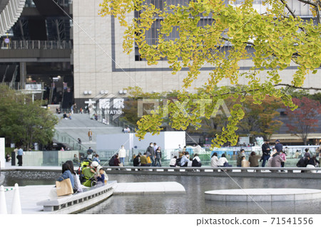 People relaxing in Umekita Plaza in front of Osaka Station on holidays November 2020 People relaxing in Umekita Plaza in front of Osaka Station on holidays November 2020 71541556