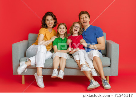 Happy loving family on bright color background. Happy loving family on bright color background. 71545117
