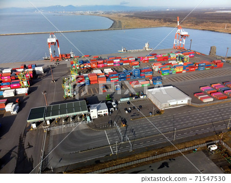Aerial view of the container terminal at Tomakomai East Port, Tomakomai City, Hokkaido Aerial view of the container terminal at Tomakomai East Port, Tomakomai City, Hokkaido 71547530