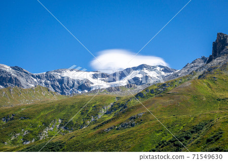 Alpine glaciers and mountains landscape in French alps. Alpine glaciers and mountains landscape in French alps. 71549630