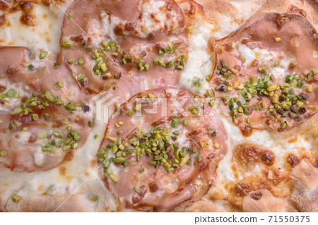 Pizza with mortadella and pistachios 71550375