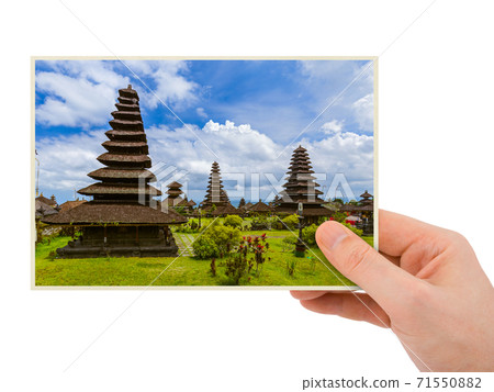 Hand and Besakih temple in Bali Indonesia (my photo) Hand and Besakih temple in Bali Indonesia (my photo) 71550882