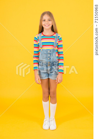 little girl yellow background. summer kid fashion. Child happy mood. Girl smiling face.  71550968