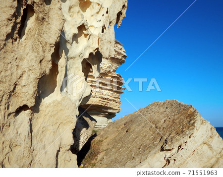 Cliffs by the sea. 71551963