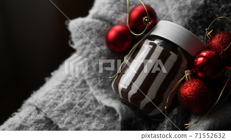 Sweet chocolate cream in the jar against Christmas background Sweet chocolate cream in the jar against Christmas background 71552632