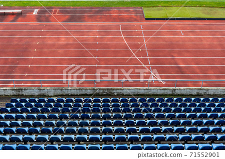 empty auditorium in athletic stadium, rows of blue chairs empty auditorium in athletic stadium, rows of blue chairs 71552901
