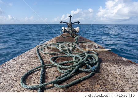 Bow side of Traditional Zanzibar Dhow boat with anchor and Rope Bow side of Traditional Zanzibar Dhow boat with anchor and Rope 71553419