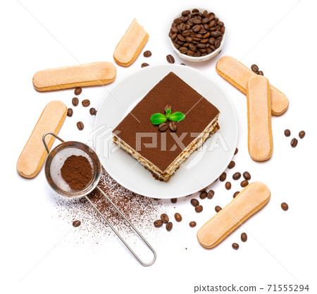 Traditional Italian Tiramisu dessert square portion on ceramic plate and savoiardi cookies isolated on white Traditional Italian Tiramisu dessert square portion on ceramic plate and savoiardi cookies isolated on white 71555294