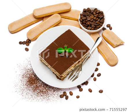 Traditional Italian Tiramisu dessert square portion on ceramic plate and savoiardi cookies isolated on white 71555297