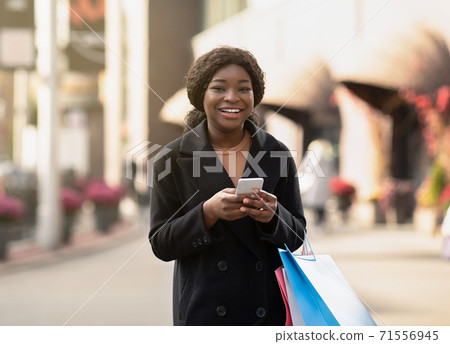 Mobile app and cash back at Black Friday and season sale concept Mobile app and cash back at Black Friday and season sale concept 71556945