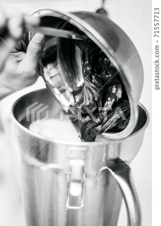 making gelato ice cream with modern equipment in kitchen interior making gelato ice cream with modern equipment in kitchen interior 71557713