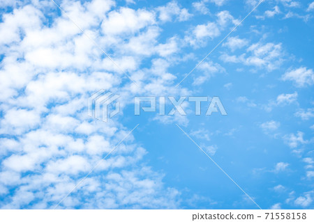 Blue sky blurred nature background with love heart clouds on paper texture 71558158