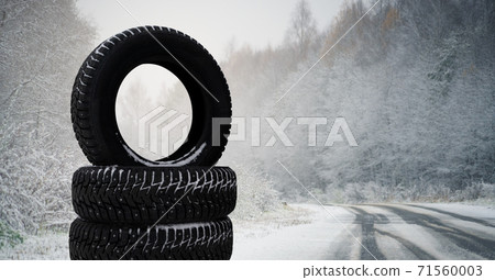 Winter tires on a snowy road 71560003