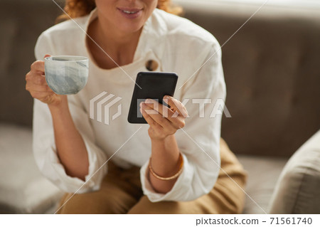 Successful Businesswoman Holding Smartphone Close Up 71561740