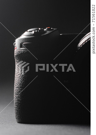 Shutter button and camera power button close up, rear view of the camera. 71561822