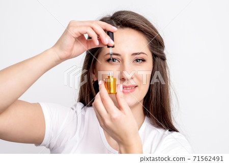 manicurist holds nail varnish bottle manicurist holds nail varnish bottle 71562491