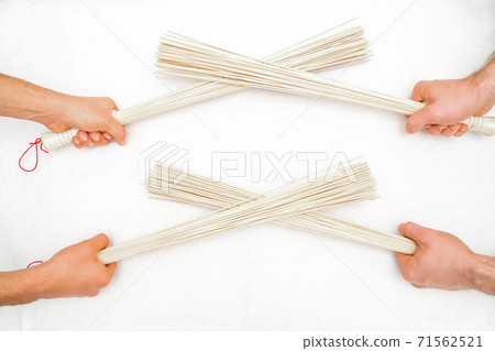 Bamboo massage brooms on white 71562521