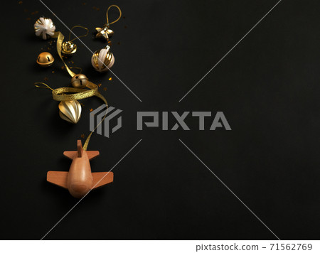 wooden children's plane on a black background wooden children's plane on a black background 71562769