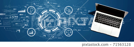 Real estate theme with a laptop computer Real estate theme with a laptop computer 71563128