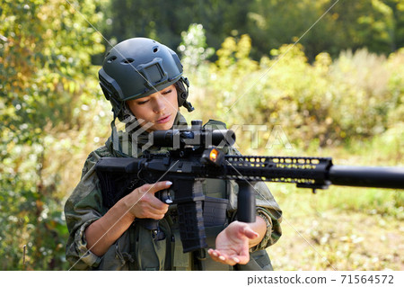 brave caucasian woman is engaged in hunting weapon gun or rifle 71564572