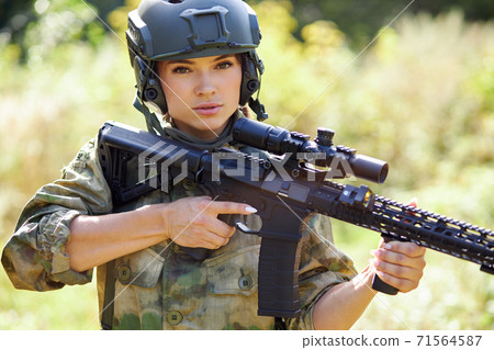 brave caucasian woman is engaged in hunting weapon gun or rifle 71564587