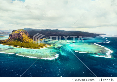 A bird's-eye view of Le Morne Brabant, a UNESCO world heritage site.Coral reef of the island of Mauritius.Storm cloud 71566710