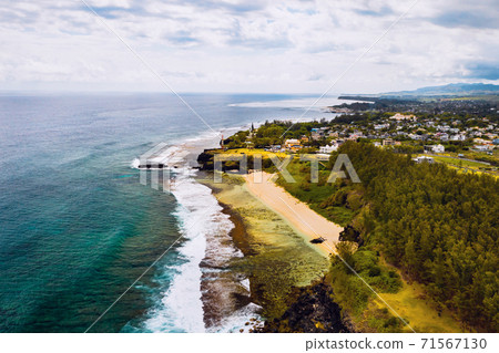 Aerial view of the cliffs of the spectacular Gris Gris Beach, in southern Mauritius. Here, is the strong waves of the Indian Ocean crashing towards the cliffs. the swimming is prohibited here. 71567130