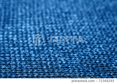 Blurred abstract background of trendy blue knitted fabric. Flat lay. Top view. Mockup for your design. Color of the year 2020 concept. Trendy blue backdrop for your design. Place for text. Blurred abstract background of trendy blue knitted fabric. Flat lay. Top view. Mockup for your design. Color of the year 2020 concept. Trendy blue backdrop for your design. Place for text. 71568293