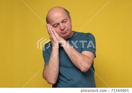 Senior caucasian handsome man sleeping tired dreaming. 71569965