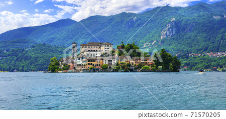Beautiful lakes of Italy - lago d'Orta (Orta San Giulio ) and small pictorial island with monastery and village . Piedmont 71570205