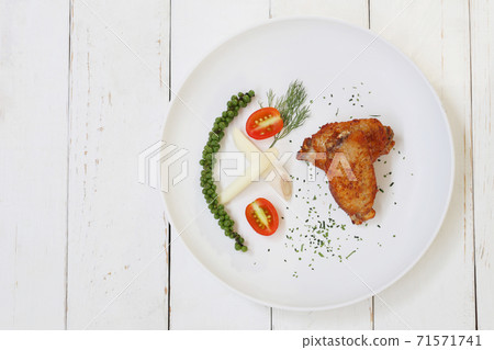 Fried Chicken wings with pepper in white dish on wooden floor. Fried Chicken wings with pepper in white dish on wooden floor. 71571741