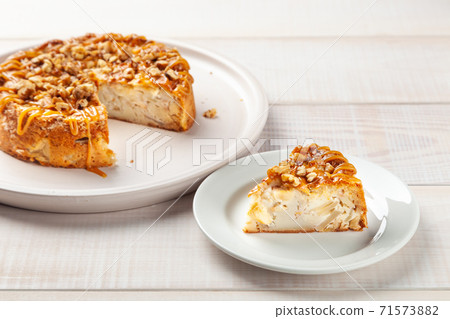 Homemade pie with jam and piece of cake near on plate 71573882