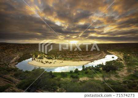 A view overlooking the beautiful sunrise in Kalbarri National Park A view overlooking the beautiful sunrise in Kalbarri National Park 71574273