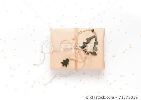 Gift box wrapped in craft paper with decor 71575019