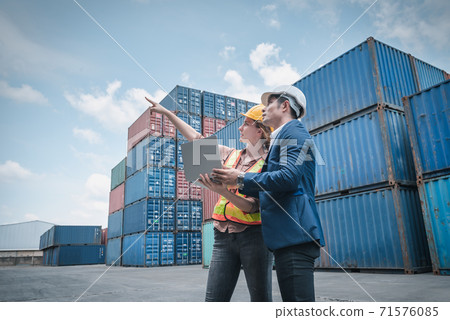 Container Shipping Logistics Engineering of Import/Export Transportation Industry, Transport Engineers Teamwork Controlling Management Containers Together at Port Ship Loading Dock. Business Team Container Shipping Logistics Engineering of Import/Export Transportation Industry, Transport Engineers Teamwork Controlling Management Containers Together at Port Ship Loading Dock. Business Team 71576085
