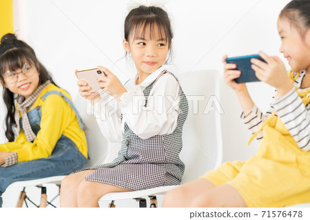 Children using smartphone Children using smartphone 71576478