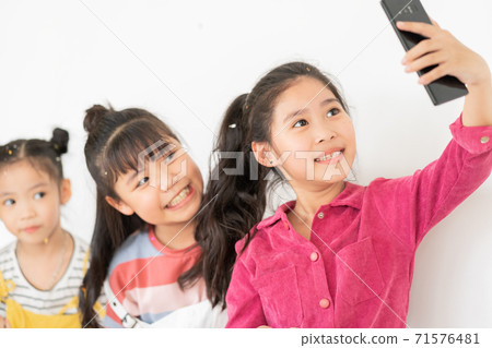 Children using smartphone Children using smartphone 71576481