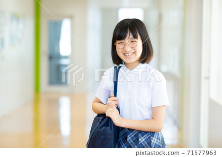 Junior high school girls enjoying school life Junior high school girls enjoying school life 71577963