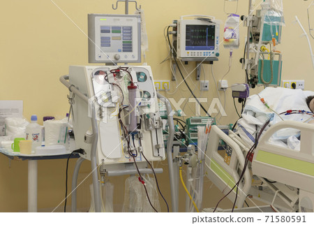 Dialysis machine, to which patient is connected in intensive care unit in hospital. The patient fell ill with a new type of coronavirus covid-19. Dialysis machine, to which patient is connected in intensive care unit in hospital. The patient fell ill with a new type of coronavirus covid-19. 71580591