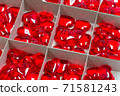 Red glass hearts in a cardboard box 71581243