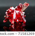 crystal of natural origin. close up of crystals in ruby color on black background 71581269