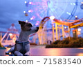 Jack Russell Terrier taking a walk in a rural amusement park at night 71583540