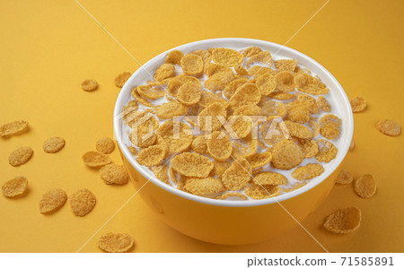 Corn flakes with milk, bowl of cereal breakfast Corn flakes with milk, bowl of cereal breakfast 71585891