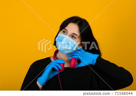 The caucasian female in blue colored protective face mask. Virus and pollution protection concept. 71586044